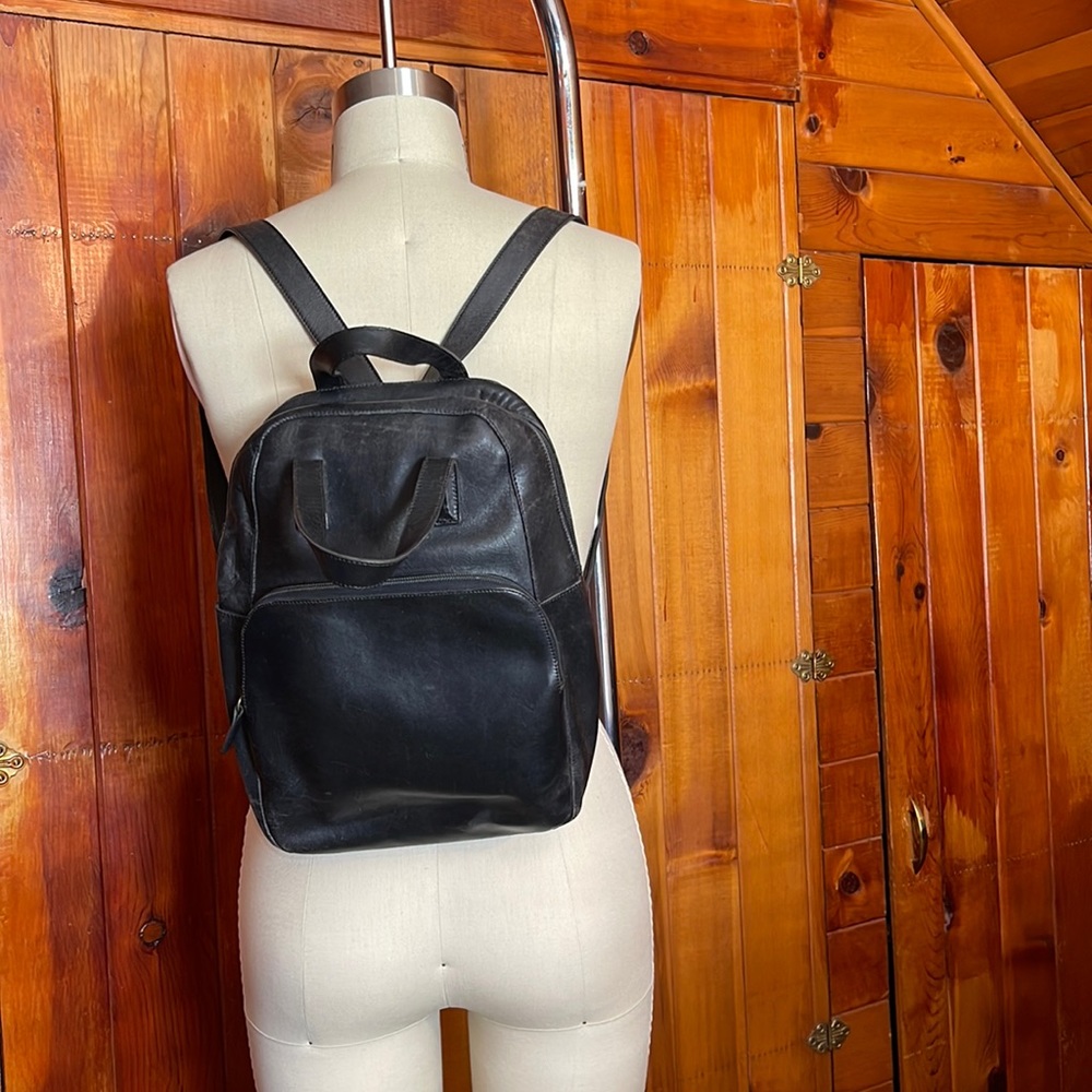 Black leather vintage Coach backpack with suede interior.